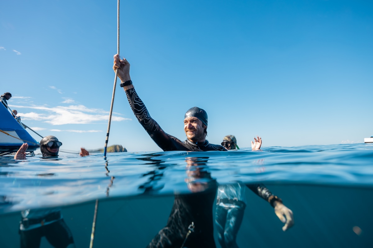 Celebration at the surface after a 70m no-fins dive