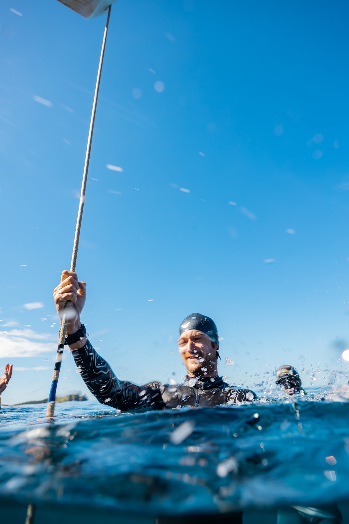 Athletes celebrate at the surface during the competition