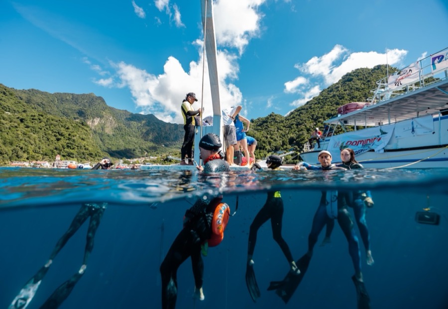 Divers and crew working the platform on a bright day in the bay
